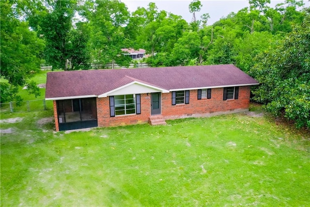 2867 Evergreen Rd, Waycross, GA 31501 - ranch-style home with a sunroom, brick siding, crawl space, roof with shingles, and entry steps