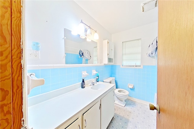 2867 Evergreen Rd, Waycross, GA 31501 - full bathroom with tile patterned flooring, vanity, wainscoting, tile walls, and a shower