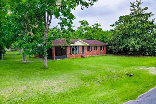 2867 Evergreen Rd, Waycross, GA 31501 - ranch-style home featuring a sunroom and brick siding