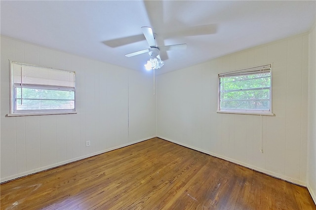 2867 Evergreen Rd, Waycross, GA 31501 - empty room with hardwood / wood-style floors, plenty of natural light, and ceiling fan