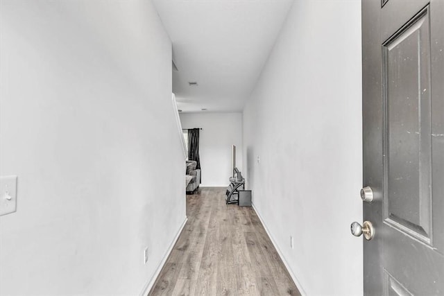 592 Brightleaf Cir, Hinesville, GA 31313 - hallway with light wood-style floors and baseboards
