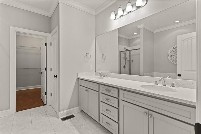 bathroom with vanity, ornamental molding, and walk in shower