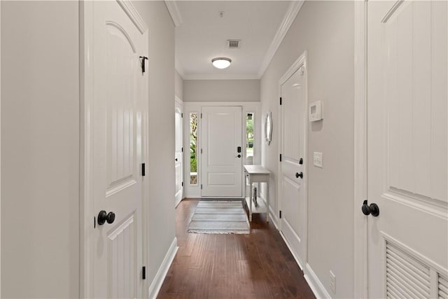 entryway featuring dark hardwood / wood-style flooring and ornamental molding