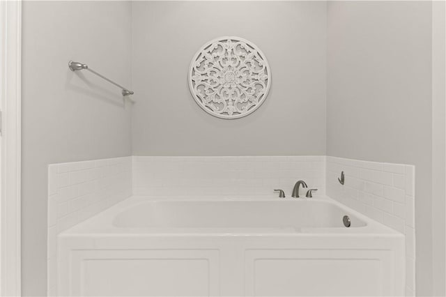 bathroom with a tub to relax in