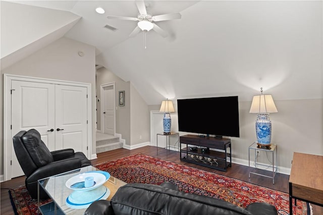 living room with vaulted ceiling, dark wood-type flooring, and ceiling fan