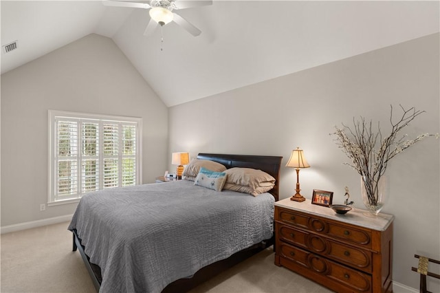 bedroom featuring light carpet, vaulted ceiling, and ceiling fan