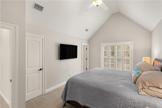 bedroom with light carpet, vaulted ceiling, and ceiling fan