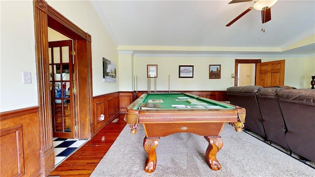 rec room with crown molding, a wainscoted wall, dark wood finished floors, pool table, and a ceiling fan