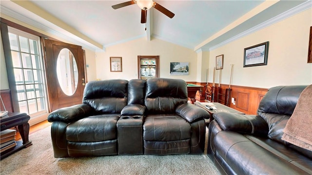 living room with lofted ceiling with beams, a wainscoted wall, and a ceiling fan