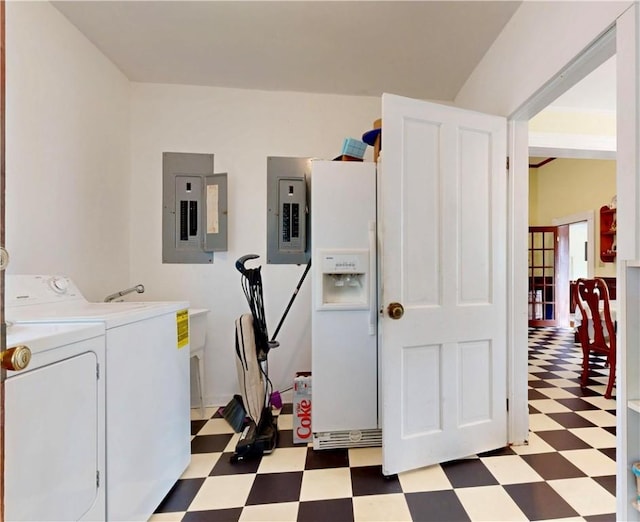 clothes washing area featuring electric panel, washing machine and clothes dryer, laundry area, and tile patterned floors