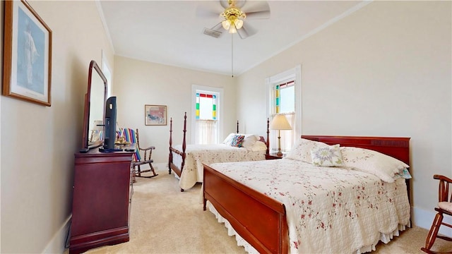 bedroom with a ceiling fan, visible vents, light colored carpet, and baseboards
