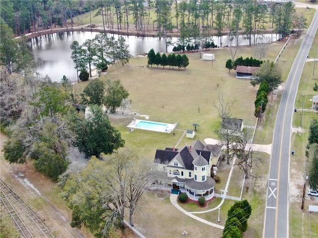 birds eye view of property with a water view