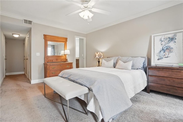 bedroom featuring light colored carpet, ornamental molding, baseboards, and ceiling fan