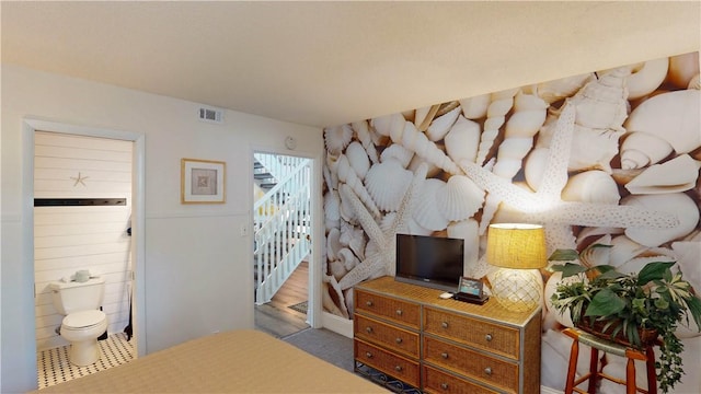 1175 N Beachview Dr Unit 337, Jekyll Island, GA 31527 - bedroom with visible vents and ensuite bathroom