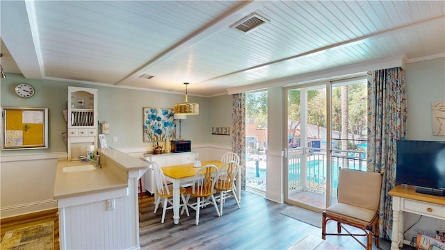 1175 N Beachview Dr Unit 337, Jekyll Island, GA 31527 - dining space featuring crown molding, wood ceiling, visible vents, and wood finished floors