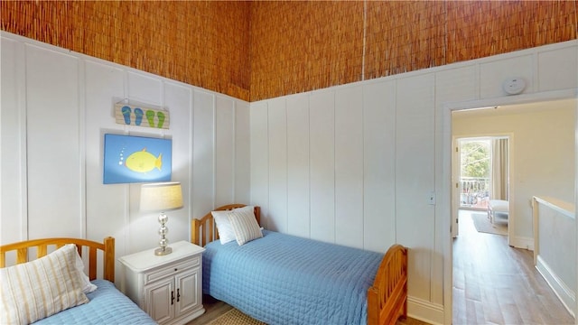 1175 N Beachview Dr Unit 337, Jekyll Island, GA 31527 - bedroom featuring wood finished floors and a decorative wall