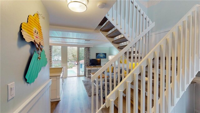 stairway with wood finished floors