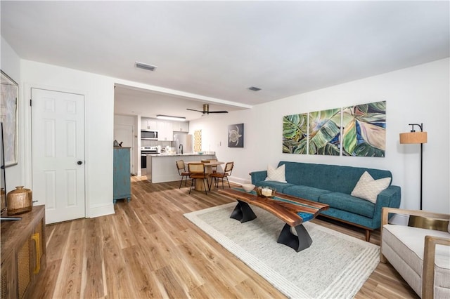 living room with light hardwood / wood-style floors