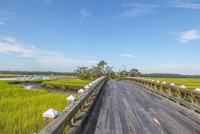 view of home's community with a water view and a rural view