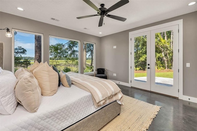 bedroom featuring multiple windows, french doors, access to outside, and ceiling fan