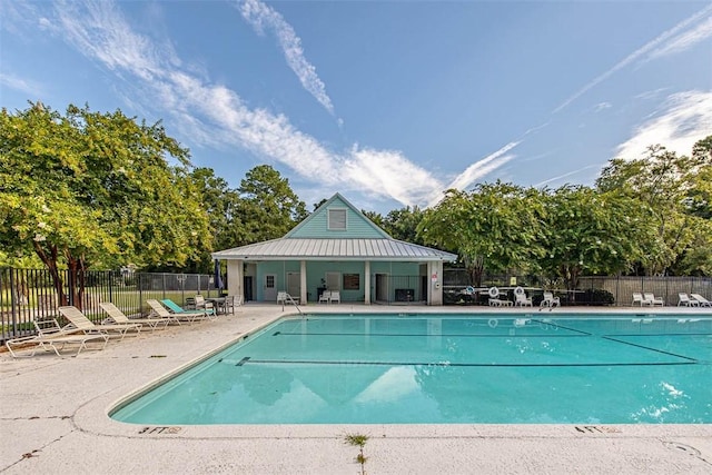 view of swimming pool with a patio