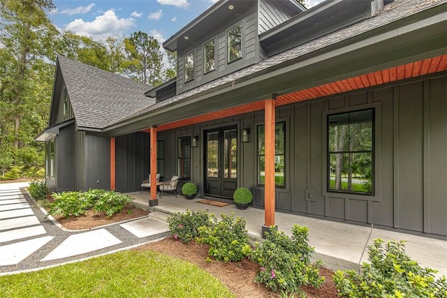 view of exterior entry featuring a porch