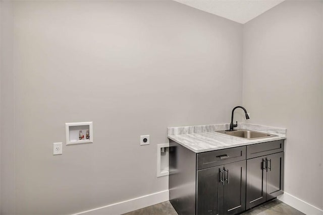 laundry room with hookup for a washing machine, sink, cabinets, and hookup for an electric dryer