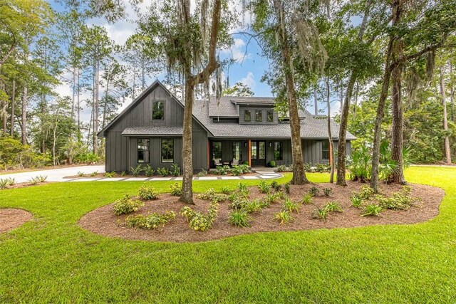 back of house featuring a lawn