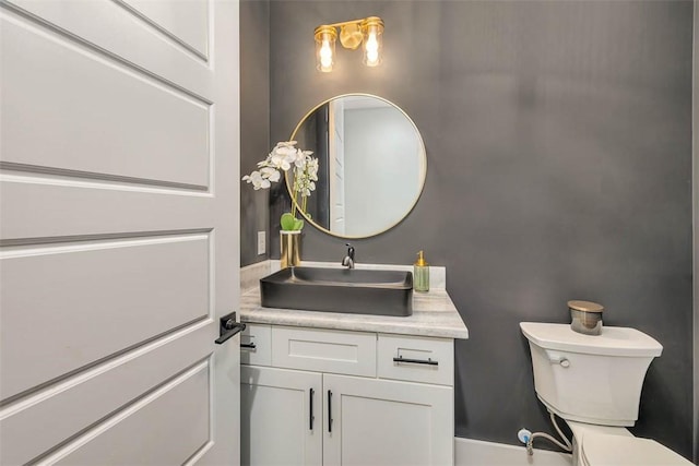 bathroom with vanity and toilet