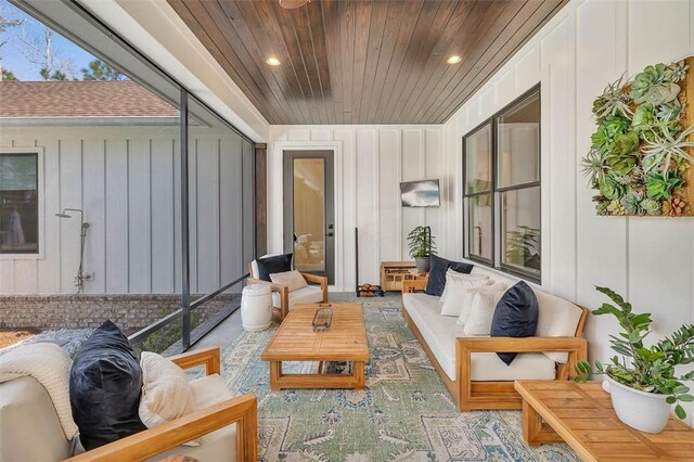 sunroom / solarium featuring wood ceiling