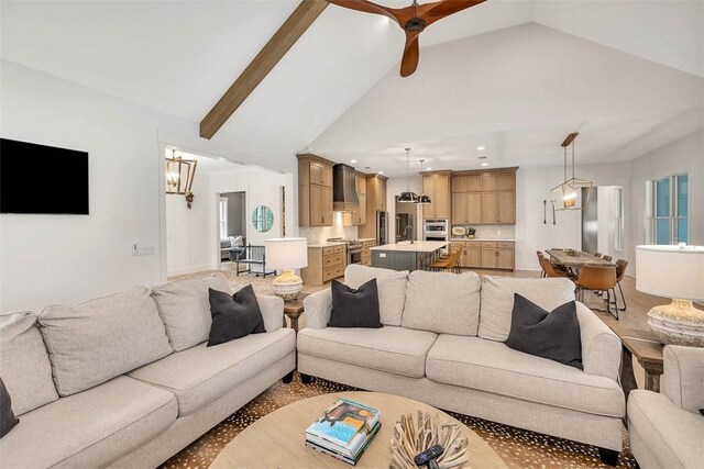 living room featuring beam ceiling, high vaulted ceiling, and ceiling fan