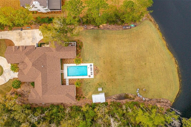 birds eye view of property with a water view