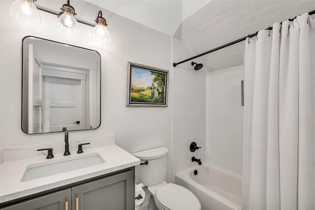 full bathroom featuring vanity, toilet, and shower / tub combo with curtain