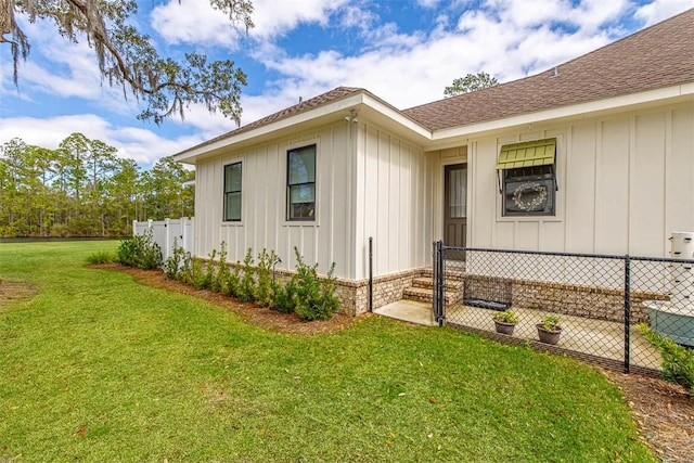 view of property exterior with a yard