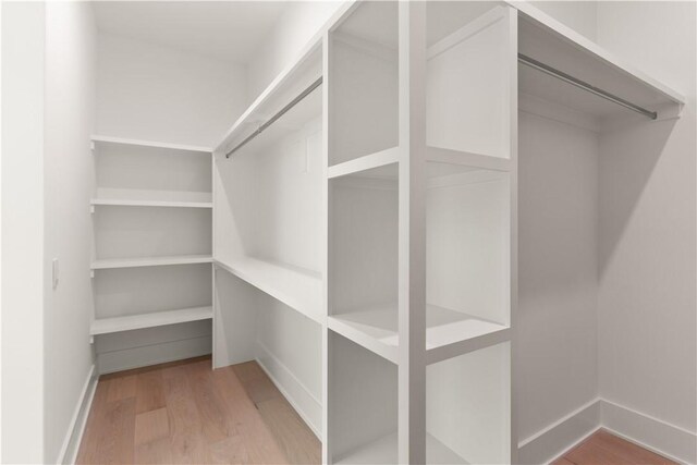 98 Thompson Cv, Saint Simons Island, GA 31522 - walk in closet with wood finished floors