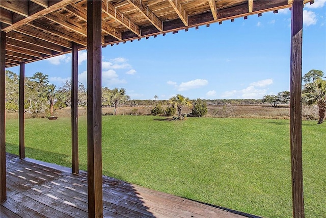 view of yard featuring a deck and a rural view