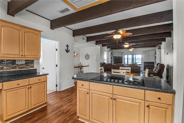 kitchen with dark countertops, black electric cooktop, visible vents, and open floor plan