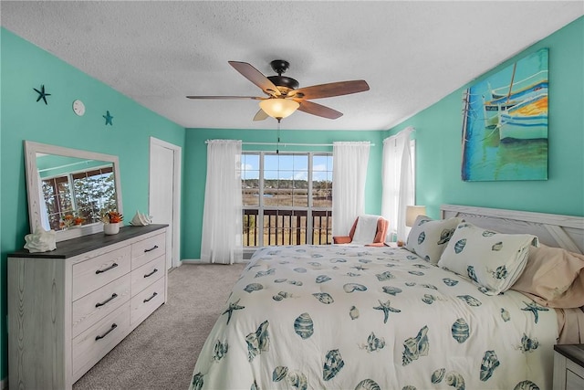 bedroom with light carpet, ceiling fan, a textured ceiling, and access to exterior