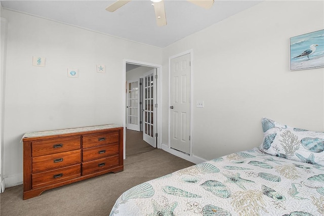 bedroom with a ceiling fan and light colored carpet