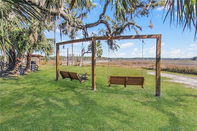 view of home's community with a lawn and a rural view