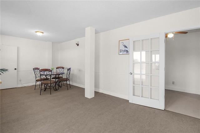 dining room featuring carpet floors and a ceiling fan