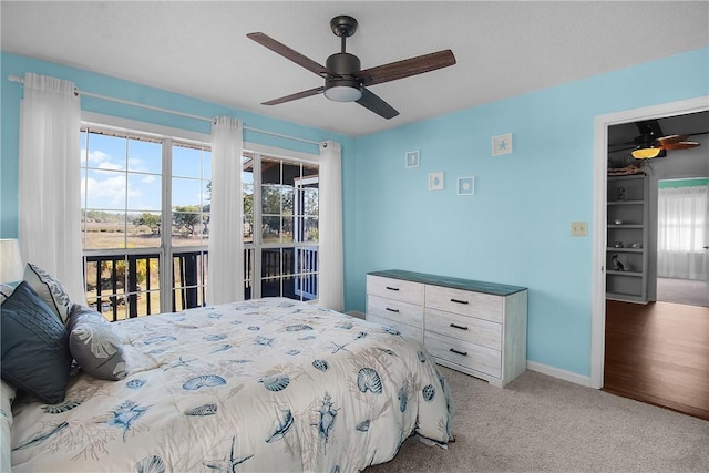 bedroom with light carpet, access to outside, baseboards, and a ceiling fan