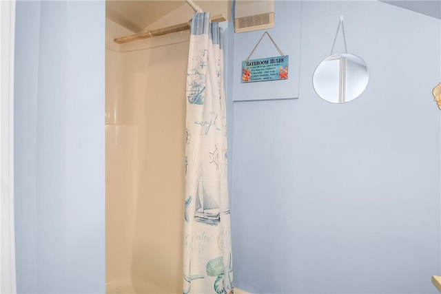 bathroom with visible vents and a shower with shower curtain