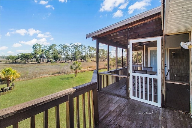 wooden deck featuring a yard