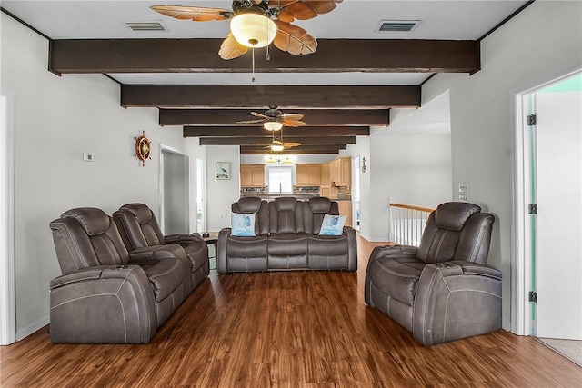 living room featuring ceiling fan, dark wood-type flooring, beamed ceiling, and visible vents