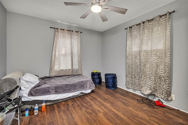 bedroom featuring wood-type flooring and ceiling fan