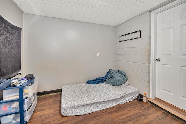 bedroom featuring dark wood-type flooring