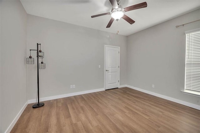 unfurnished room with ceiling fan and light hardwood / wood-style flooring