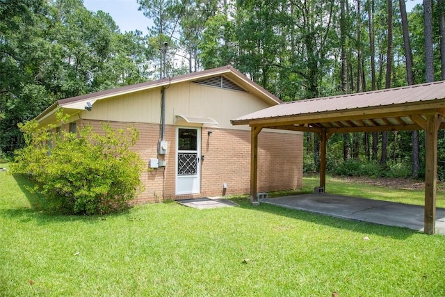 320 Brobston St, Baxley, GA 31513 - view of front of home with brick siding and a front yard