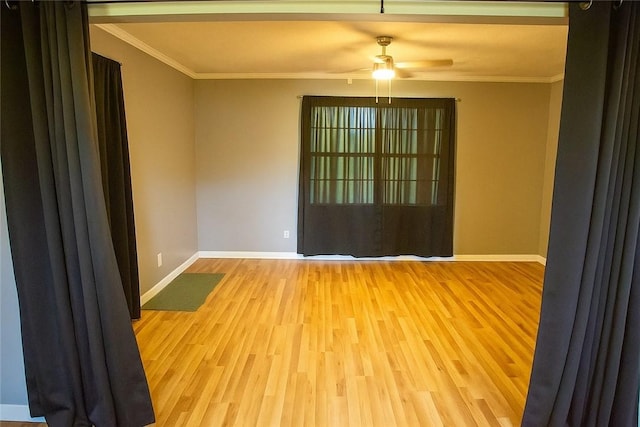320 Brobston St, Baxley, GA 31513 - empty room featuring light wood finished floors, crown molding, and a ceiling fan
